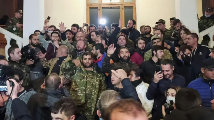 IMAGES Several thousand Armenian protesters angry over the country's agreement to end fighting with Azerbaijan over the disputed Nagorno-Karabakh region gather at the government headquarters in Yerevan.