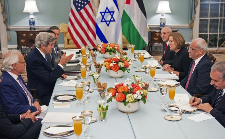In this picture taken on July 29, 2013, then US Secretary of State John Kerry dines with Israeli Justice Minister Tzipi Livni and Palestinian chief negotiator Saeb Erekat at the US Department of State in Washington