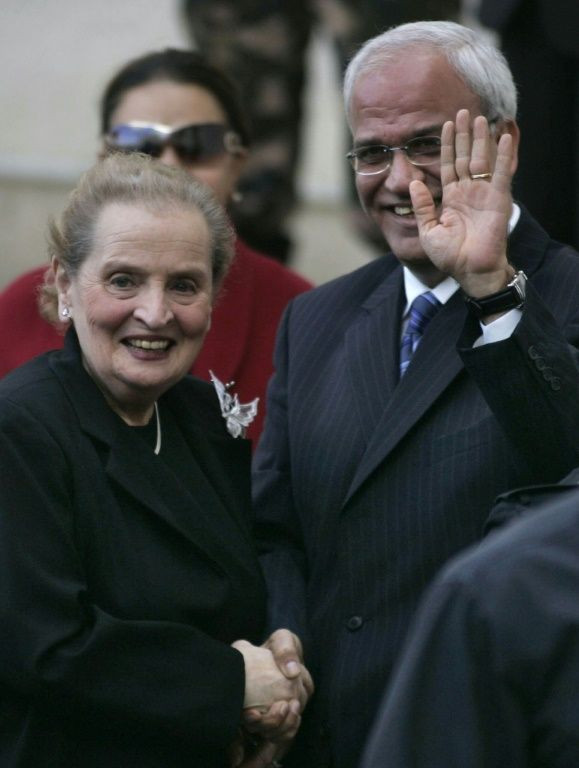 In this file photo taken on December 06, 2007, former US secretary of state Madeleine Albright (L) is received by Palestinian peace negotiator Saeb Erekat in the West Bank city of Ramallah