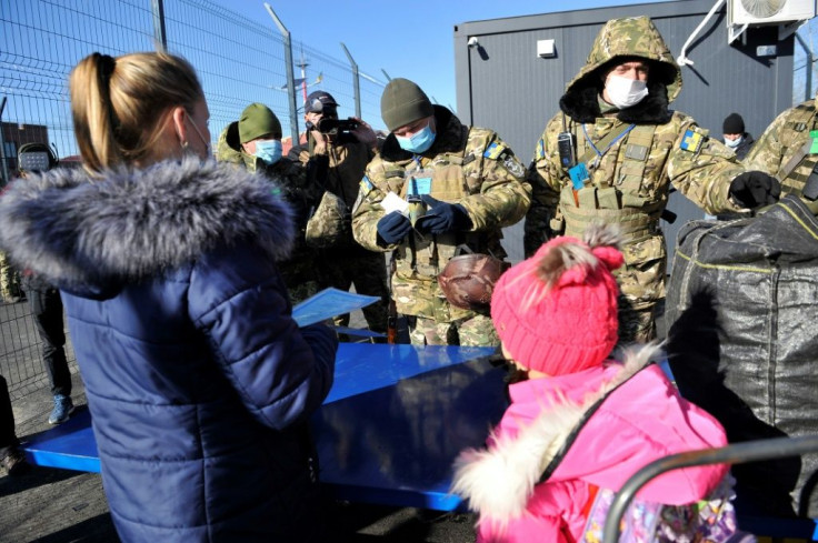 People laden with bags approached the crossing point at Schastya but were soon turned back by separatist authorities in Lugansk region