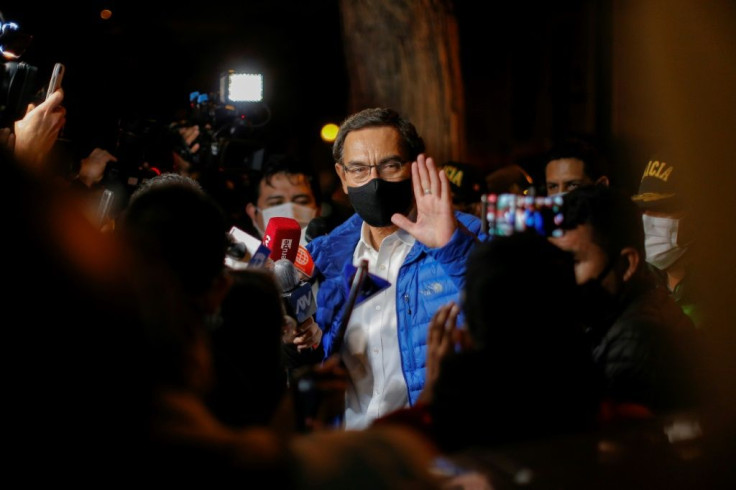 Former Peruvian President MartÃ­n Vizcarra waves to the press upon his arrival home after leaving the Presidential Palace in Lima,on November 09, 2020, following his impeachment by an overwhelming majority Congress