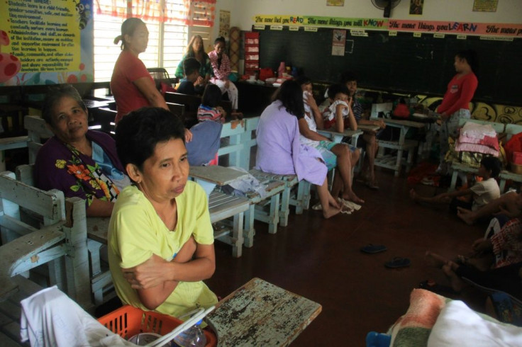 Residents shelter in a classroom used as an evacuation centre in Camalig, Albay province