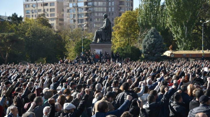 Thousands of Armenians rallied in front of the government headquarters to protest against a peace agreement signed to end fighting over the disputed Nagorno-Karabakh region.