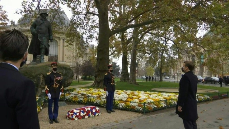 IMAGES French President Emmanuel Macron lays a wreath and observes a minute's silence in front of the statue of former French Prime Minister Georges Clemenceau during a ceremony to mark the 102nd anniversary of Armistice Day. Clemenceau was and remains a 