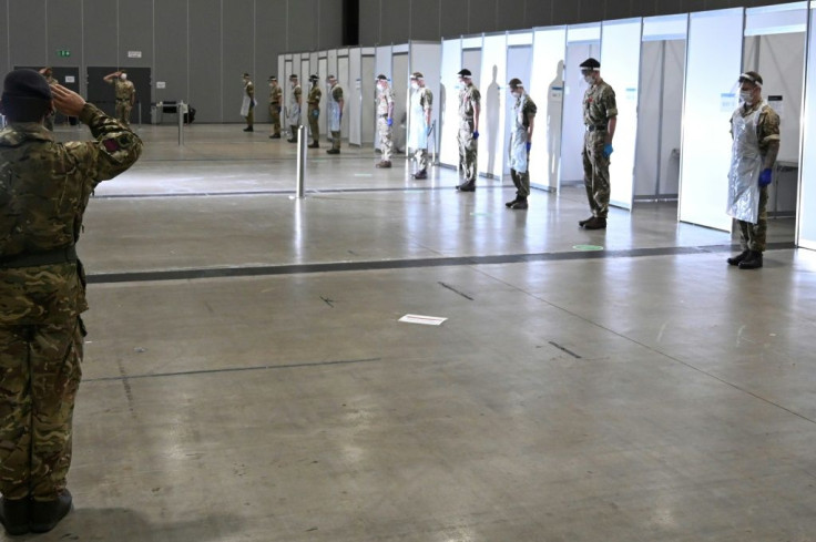Soldiers observed two minutes of silence on Armistice day at a coronavirus rapid testing centre in the Liverpool exhibition centre in Liverpool