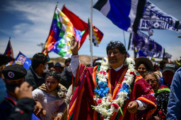 Bolivia's former president Evo Morales is surrounded by supporters in his hometown Orinoca, on November 10, 2020