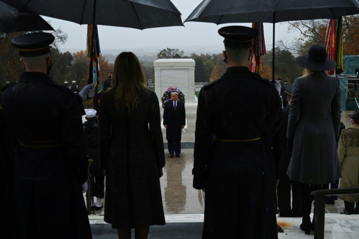 US President Donald Trump (center) attends a wreath-laying ceremony to mark Veterans Day on November 11, 2020 at Arlington National Cemetery in Arlington, Virginia