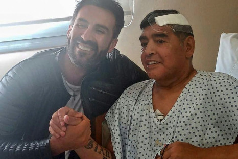 Argentine football legend Diego Maradona (R) and his doctor Leopoldo Luque are pictured in Olivos, Argentina on November 11, 2020 Maradona is expected to leave hospital on Wednesday, eight days after undergoing surgery to remove a blood clot on his brain
