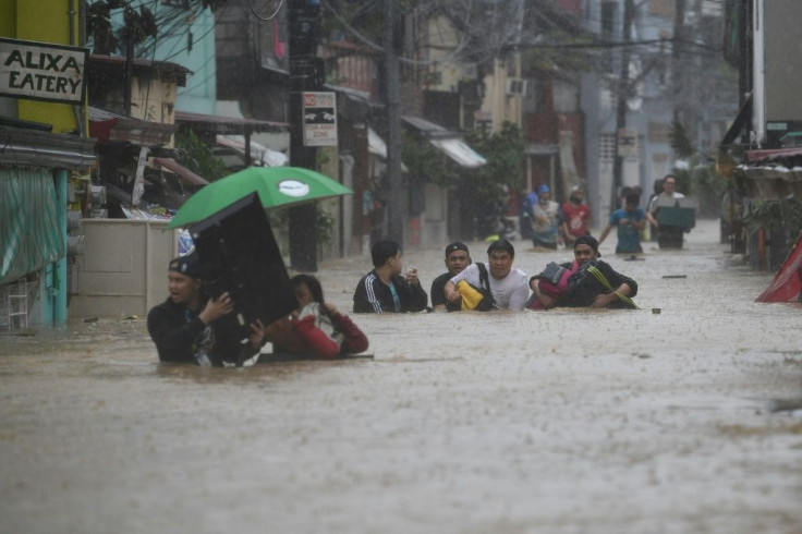 Typhoon Vamco brought heavy flooding to suburban Manila on Thursday, with authorities warning of life-threatening storm surges on the way