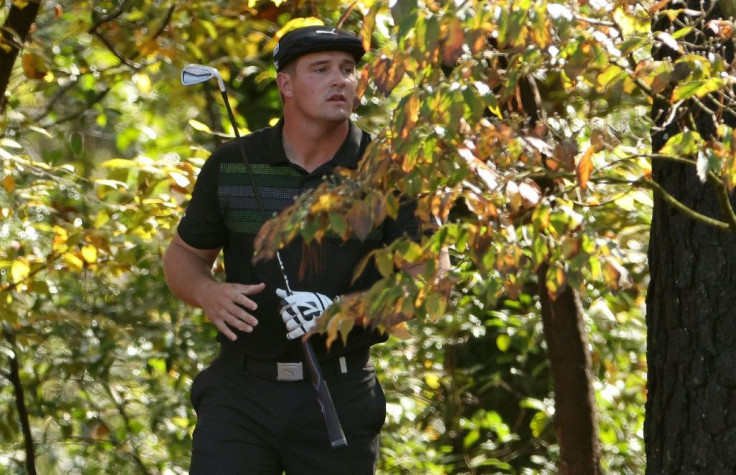 US Open champion Bryson DeChambeau went into the trees on two of his first four holes on the way to a 2-under effort in the first round of the Masters
