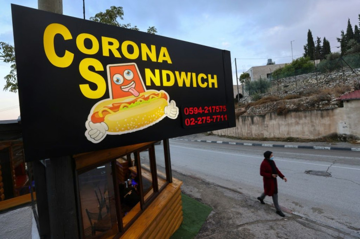 The "Corona Sandwich" restaurant, close to the Church of the Nativity in the occupied West Bank town of Bethlehem, was opened amid a collapse of the tourist industry as tour guide Raed Bannura looked for an alternative source of income