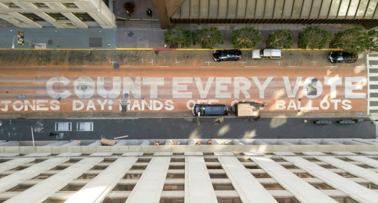 An aerial view of the slogan "Count Every Vote. Jones Day: Hands off our ballots" is seen on November 10, 2020 on a San Francisco street
