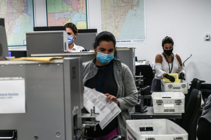 Election workers count ballots in Miami on November 3, 2020