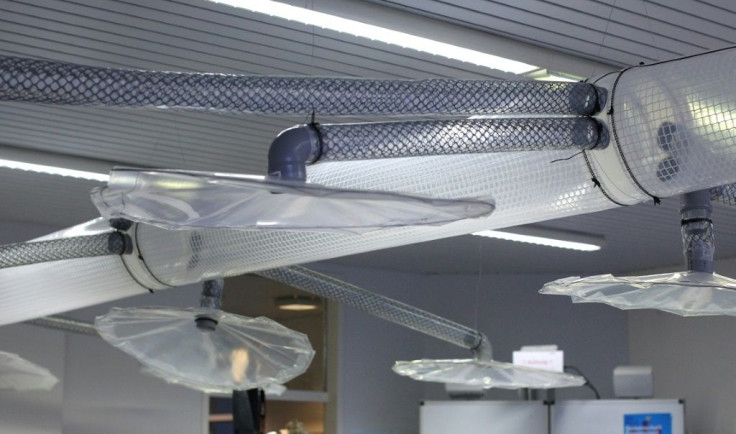 Warm breath exhaled by the pupils, potentially carrying virus-laden tiny particles known as aerosols, rises up and is sucked through tubes and pushed outsideÂ