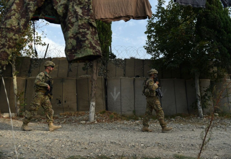 US soldiers patrol in front of an Afghan army base in August 2015 in eastern Nangarhar province