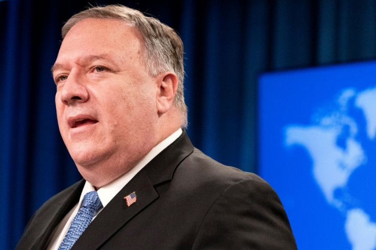 Secretary of State Mike Pompeo, seen addressing reporters on November 10, 2020, is insisting before an international trip that President Donald Trump will remain in power
