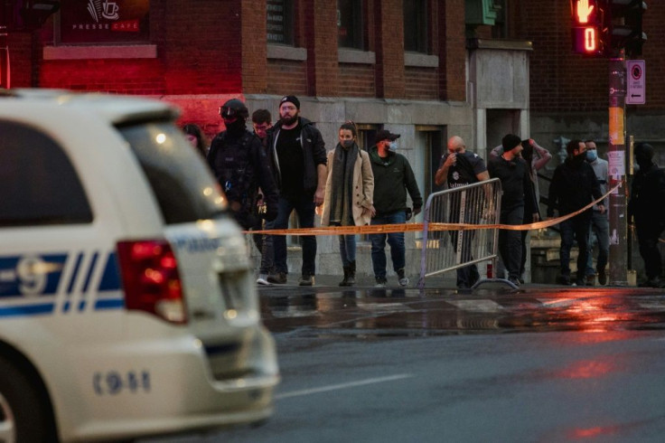 People are evacuated from the Ubisoft office in Montreal amid a major police operation in response to what local media said was a possible hostage-taking, but no threat had yet been found