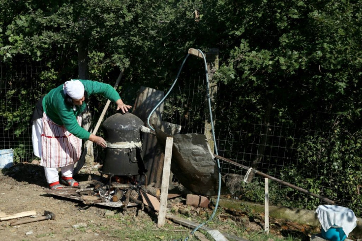 Like many women in Albania, Vitore Lufi, 64, makes raki, a popular fruit brandy