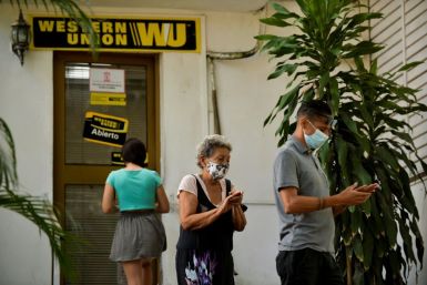 Cubans queue outside a Western Union office in Havana on October 28, 2020