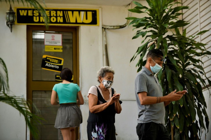 Cubans queue outside a Western Union office in Havana on October 28, 2020