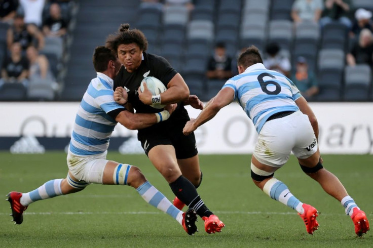 Argentina's Guido Petti (L) and Pablo Matera (R) tackles New Zealand's Caleb Clarke during the 2020 Tri-Nations rugby match between the New Zealand and Argentina at Bankwest Stadium in Sydney on November 14, 2020.