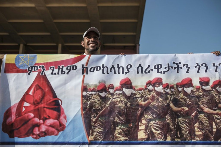 A man stands behind a banner during a blood donation rally organised by the city administration of Addis Ababa