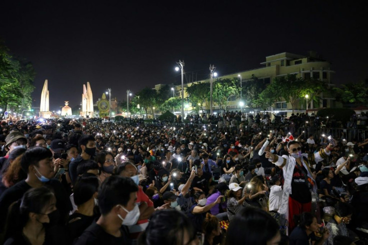 Pro-democracy protesters take part in an anti-government rally next to the Democracy Monument in Bangkok on November 14, 2020