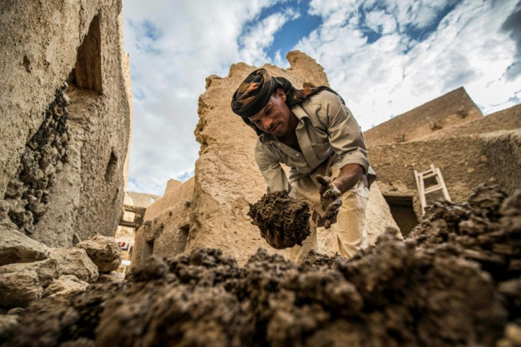An Egyptian labouror works on the restoration of the Shali fortress