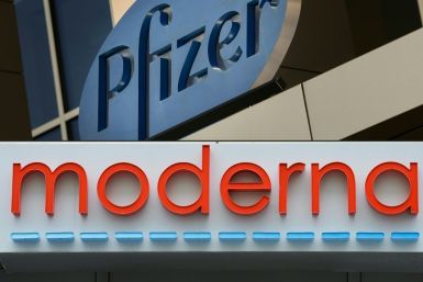 This combination of file pictures shows signs for the Pfizer and Moderna pharmaceutical companies, both in Cambridge, Massachusetts; executives at both, as well as at Novavax, have raised questions by selling shares worth millions amid  the pandemic