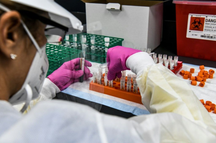 A technician sorts blood samples