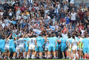 Argentina's players celebrate with fans after beating the All Blacks