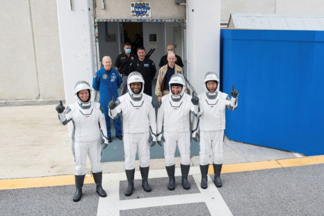 NASA astronauts Shannon Walker (L), Victor Glover (2nd L), Mike Hopkins (2nd R) and Japan Aerospace Exploration Agency (JAXA) astronaut Soichi Noguchi (R), are pictured wearing SpaceX spacesuits in a dress rehearsal ahead of the Crew Dragon launch