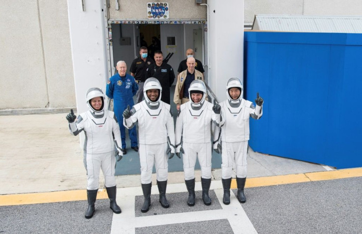 NASA astronauts Shannon Walker (L), Victor Glover (2nd L), Mike Hopkins (2nd R) and Japan Aerospace Exploration Agency (JAXA) astronaut Soichi Noguchi (R), are pictured wearing SpaceX spacesuits in a dress rehearsal ahead of the Crew Dragon launch