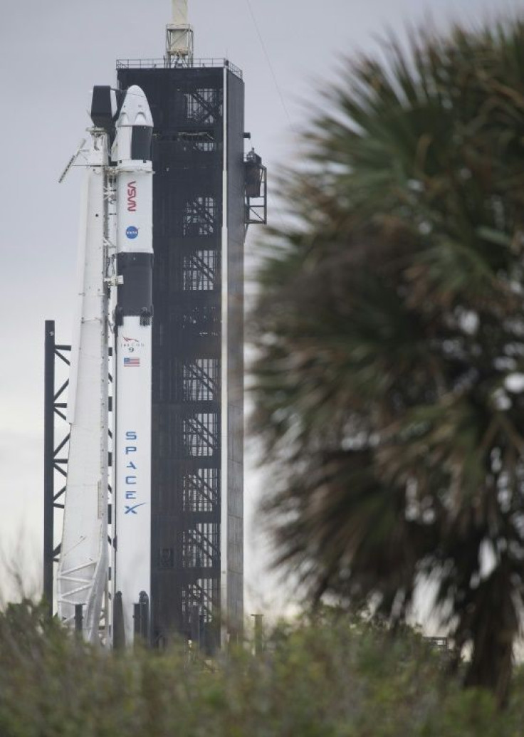 This handout photo released by NASA shows a SpaceX Falcon 9 rocket with the company's Crew Dragon spacecraft onboard on the launch pad at NASA's Kennedy Space Center in Florida on November 14, 2020