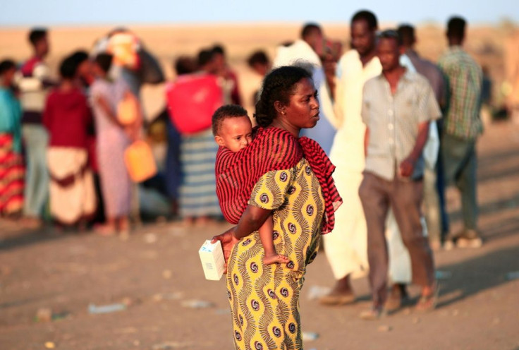 Ethiopian refugees fleeing the intense fighting in their homeland of Tigray gather at a border reception centre in eastern Sudan