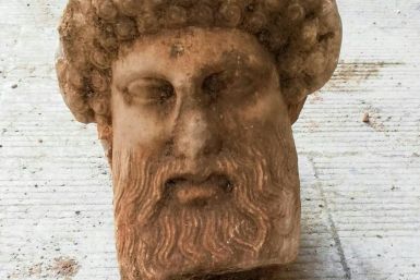 This handout picture released by the Greek Culture Ministry on November 15, 2020, shows the head of an ancient statue of the Greek god Hermes, in Athens, which has been unearthed during excavations for sewage system improvements in central Athens, the min