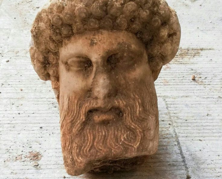 This handout picture released by the Greek Culture Ministry on November 15, 2020, shows the head of an ancient statue of the Greek god Hermes, in Athens, which has been unearthed during excavations for sewage system improvements in central Athens, the min