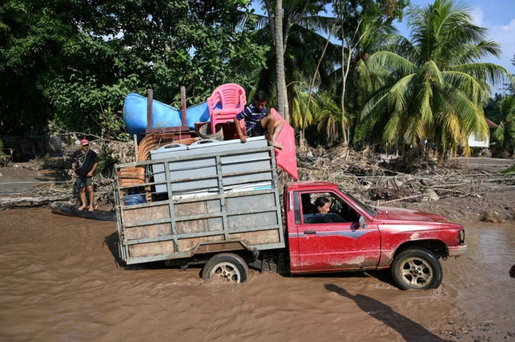 Workers evacuate from a banana plantation near El Progreso, Honduras, ahead of Hurricane Iota, in November 2020