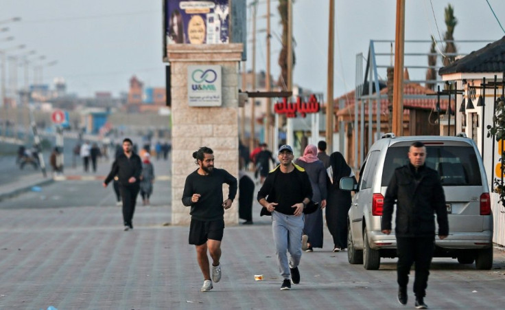 Palestinians exercise at dawn in Gaza; as the pandemic has dragged on, larger crowds are using Gaza's Mediterranean coastline to relieve some stress