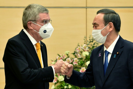 IOC president Thomas Bach (L) met Japan's Prime Minister Yoshihide Suga in Tokyo