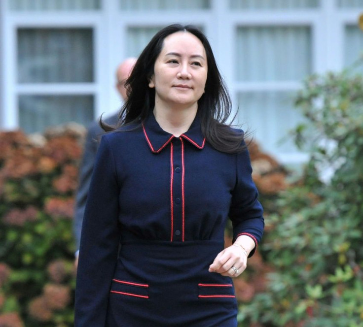 In this file photo taken on October 27, 2020, Huawei executive Meng Wanzhou leaves her Vancouver home to appear in court in Vancouver, British Columbia, Canada