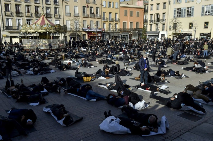 French protestors dress in black to represent the "death" of their businesses during partial lockdown
