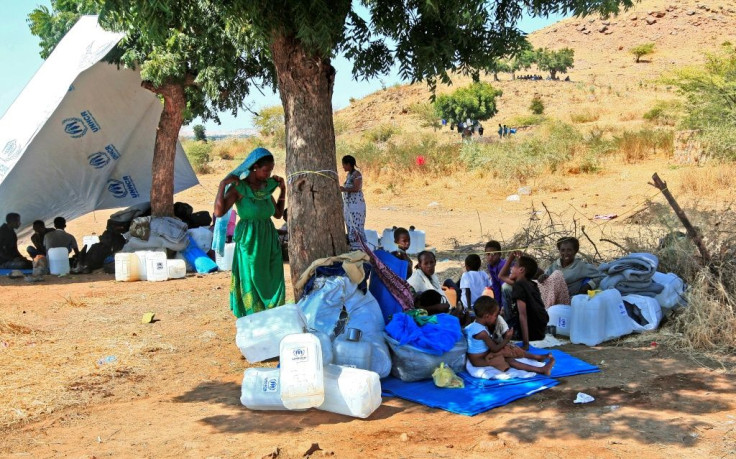 Ethiopian refugees who fled intense fighting in their homeland gather in Sudan's Um Raquba camp