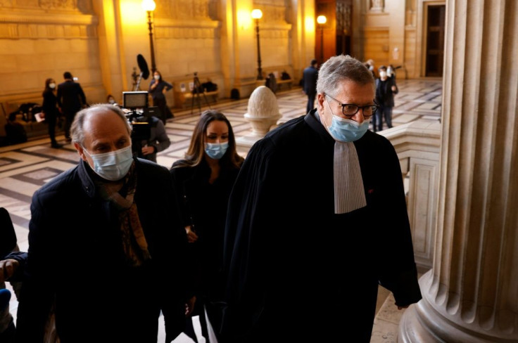 Lawyer Jean Weil (R), representing the railways, enters the court for the trial of a Moroccan over a foiled terror attack on an Amsterdam-Paris train in August 2015