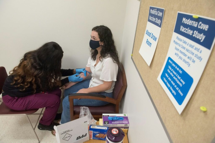 A volunteer is tested before being given the Moderna vaccine in Detroit, Michigan