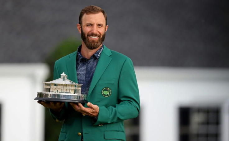 Dustin Johnson holds the Masters Trophy after his record-breaking 20-under par victory total at Augusta