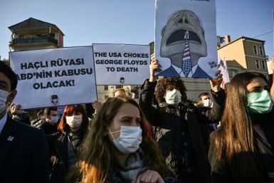 Memebers of Turkish Youth Union (TGB) chant anti-US slogans and hold placards