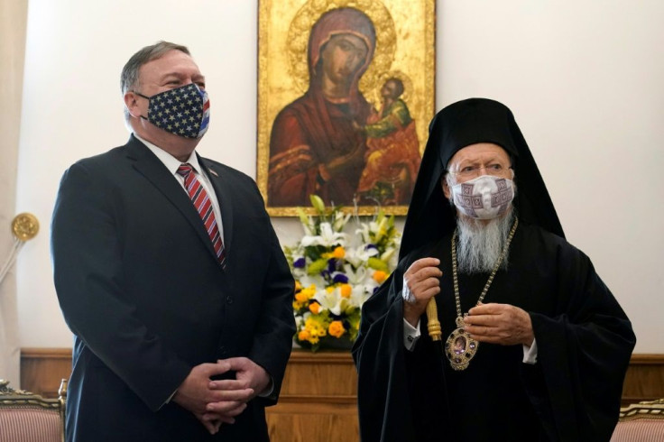 US Secretary of State Mike Pompeo (L) listens to Ecumenical Patriarch Bartholomew I