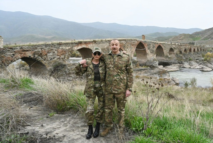 The couple took pictures against the backdrop of the mediaeval Khudaferin bridge at the country's border with Iran