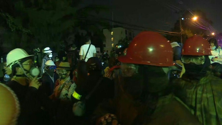 IMAGESPro-democracy demonstrators scatter in the streets of Bangkok after police use water cannons and tear gas to prevent them from approaching parliament. Thai deputies and senators are debating possible constitutional reform called for by the pro-democ